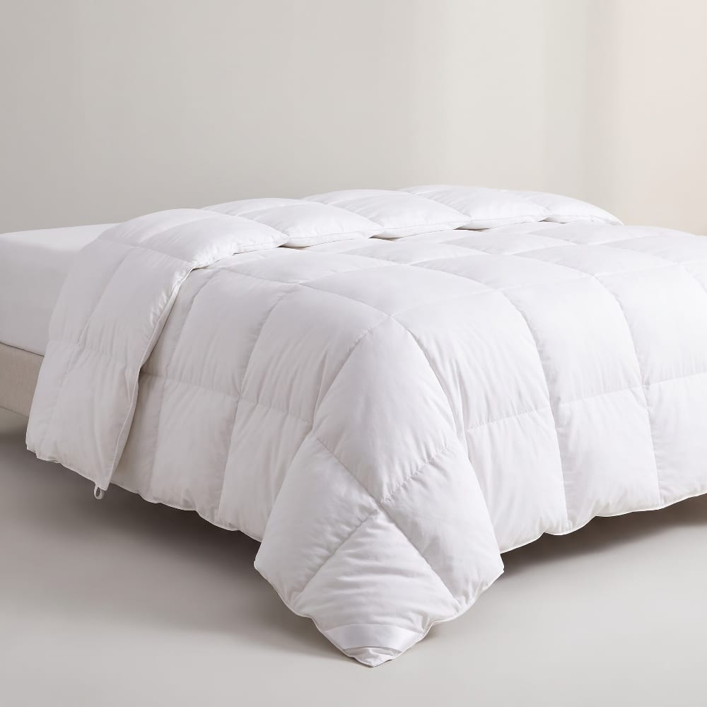 Folded white box-stitched down-alternative comforter with a lofty quilted surface