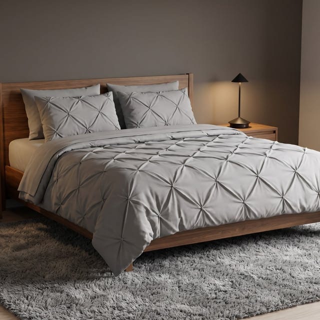 Gray bedding and shag rug in a charcoal room