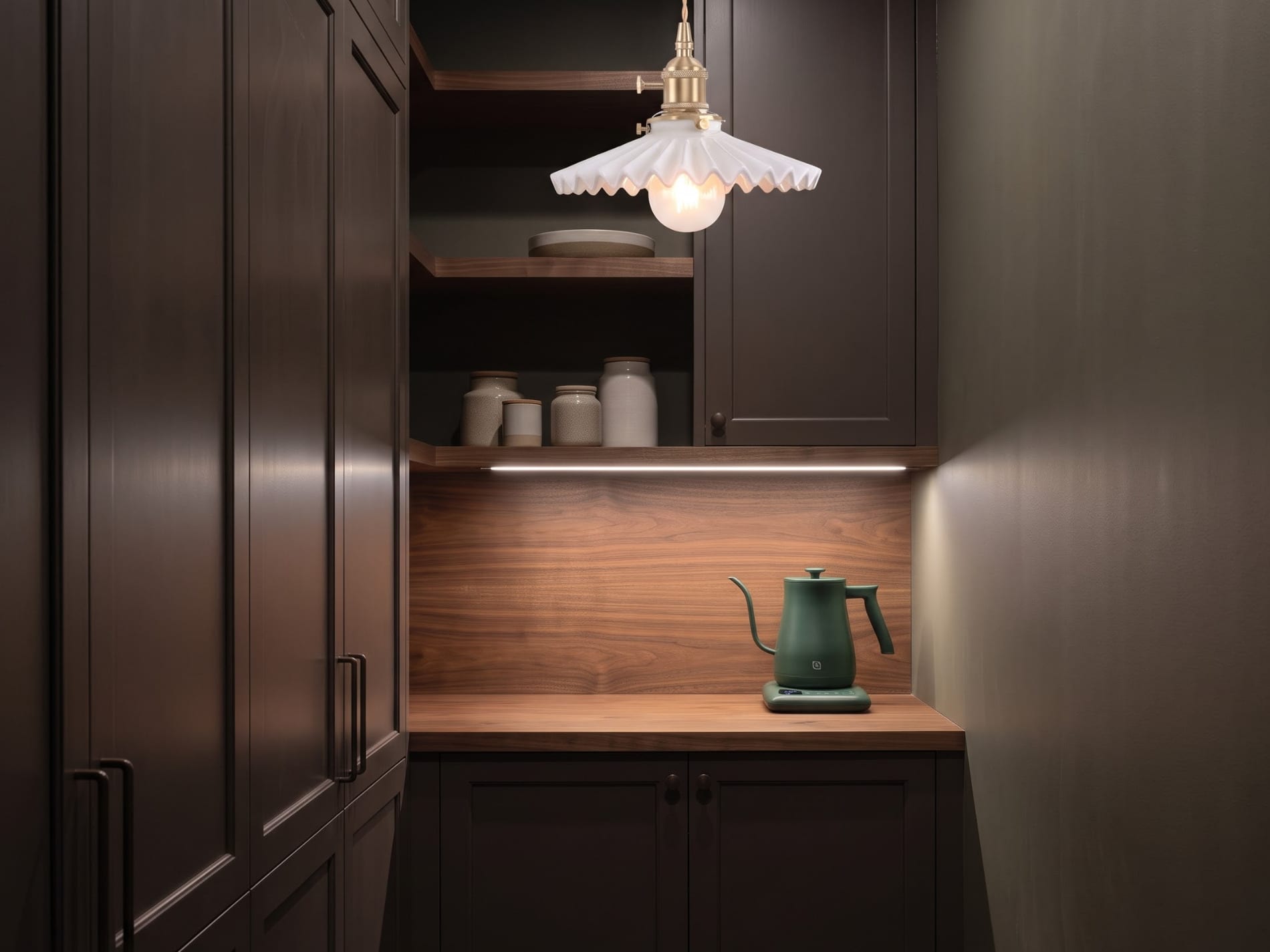Dark pantry cabinetry with warm task lighting