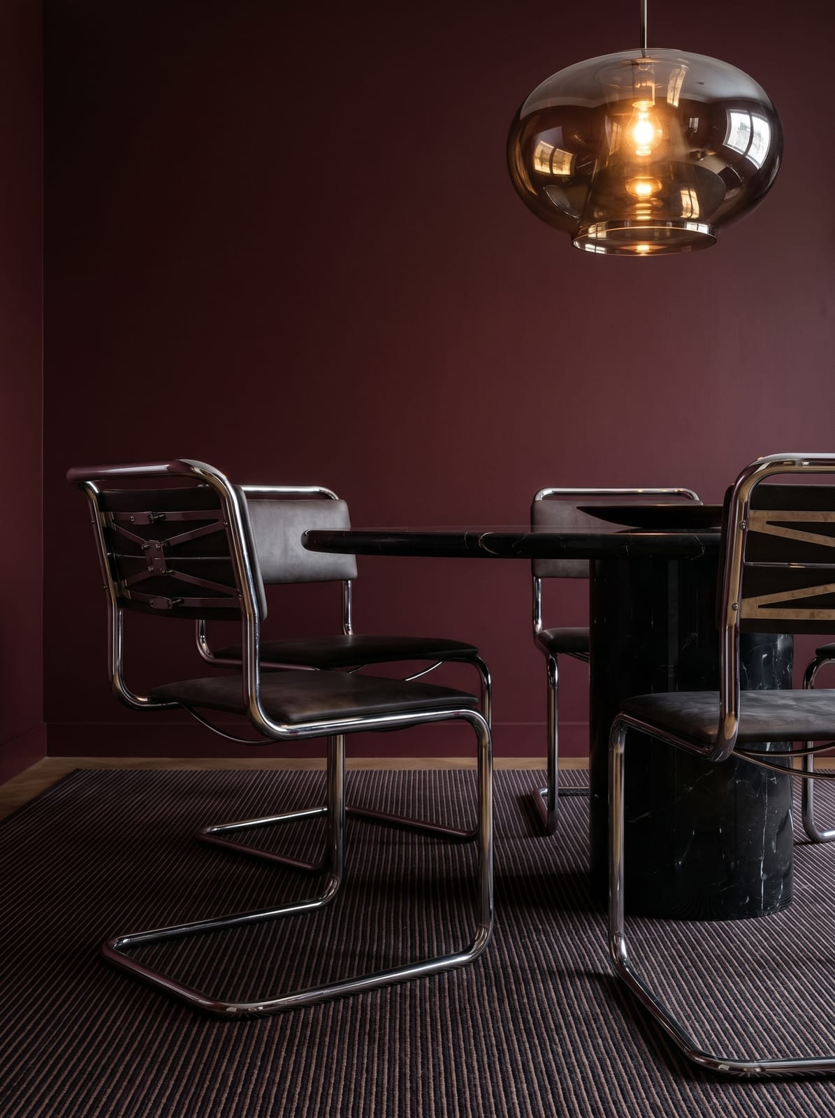 Burgundy Dining Room — warm modern dining room interior concept with plaster, chrome, stone