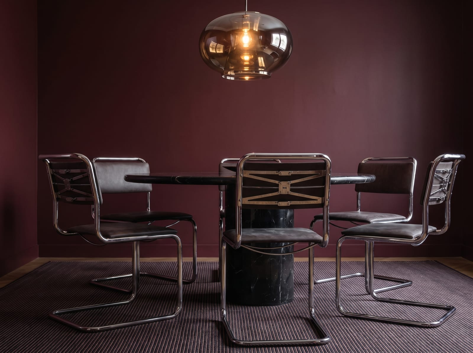 Burgundy Dining Room — warm modern dining room interior concept featuring plaster, chrome, stone