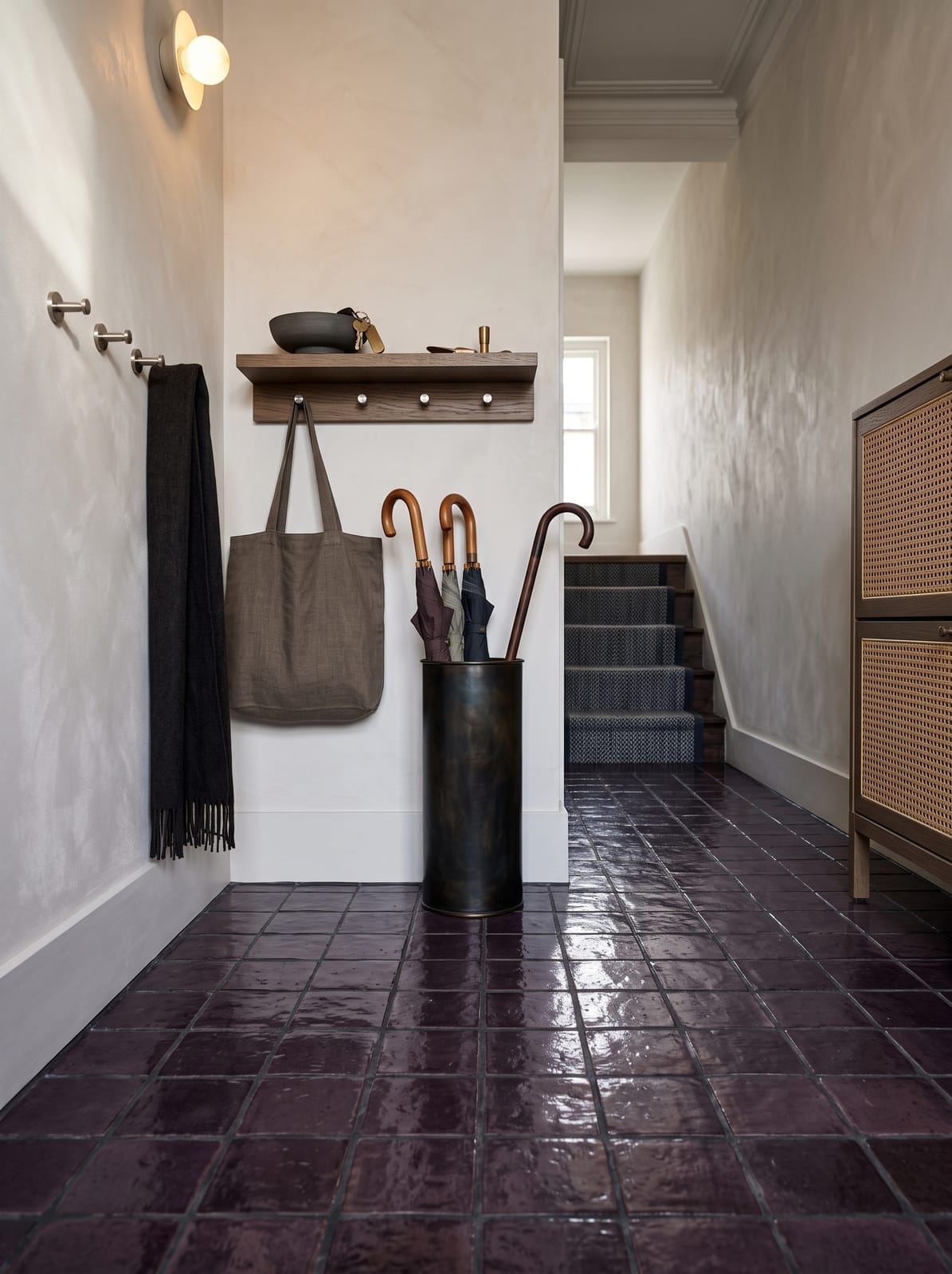 Moody Entry Hallway — warm modern entryway interior concept with plaster, oak, copper